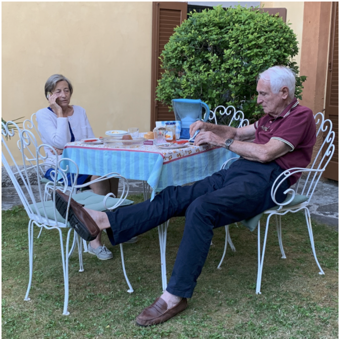 Family relaxing in the villa garden