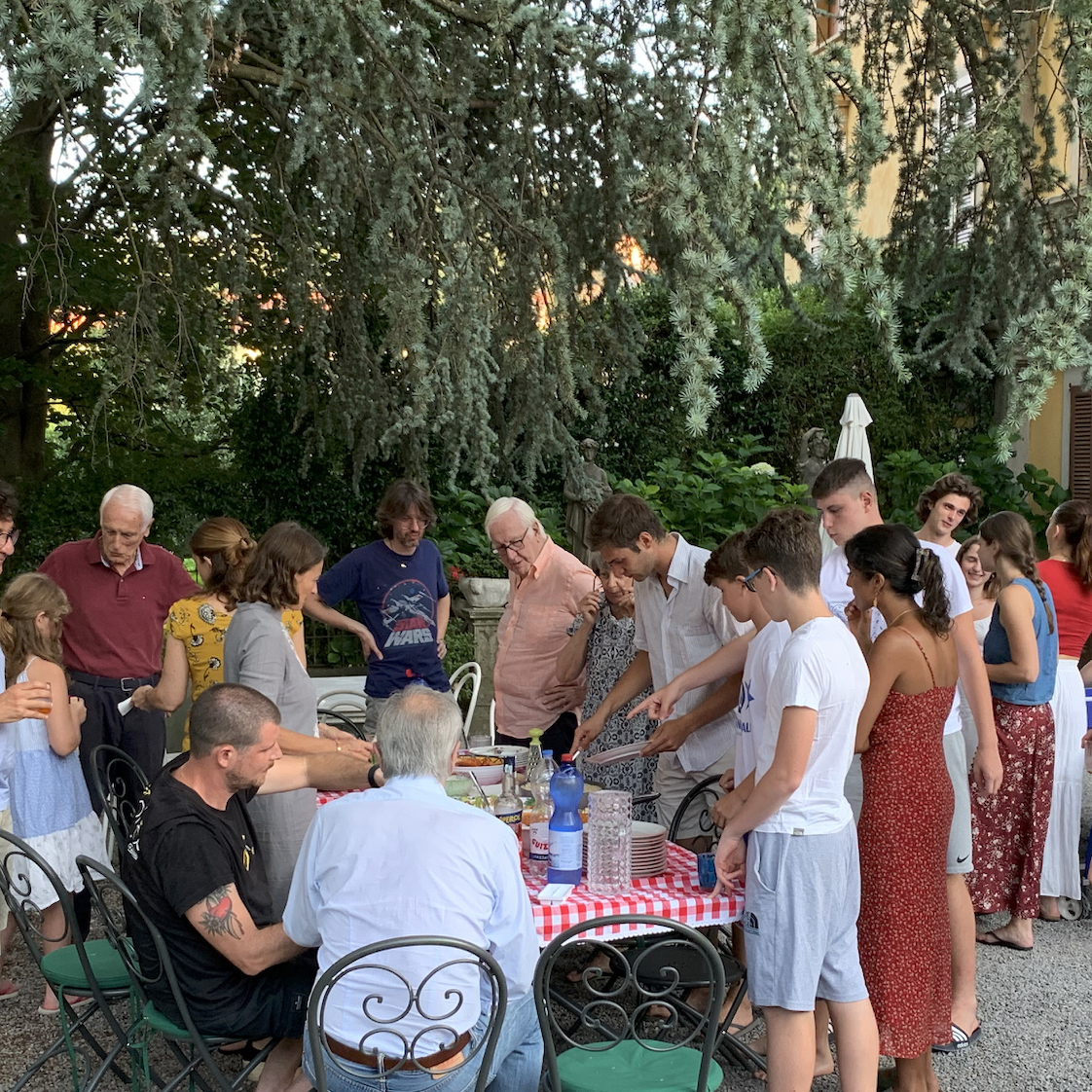 Family and friends gathered for an outdoor meal